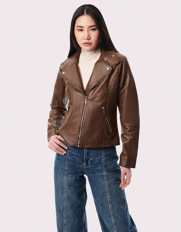 womens versatile genuine leather jacket that is made from genuine leather paired with denim and pants