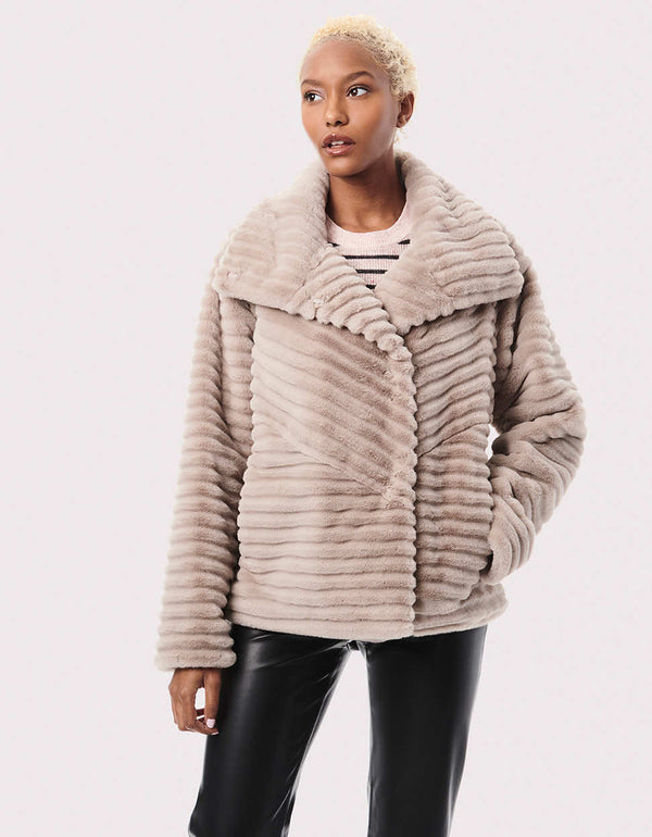 classic hip length fit light brown colored faux fur jacket for women with lightweight layer and oversized dramatic collar