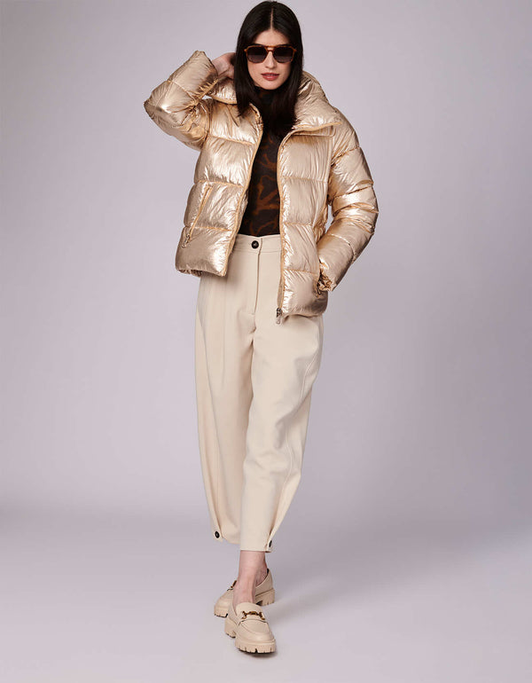 stylish and trendy puffer jacket for women in color gold in a oversized hip length fit