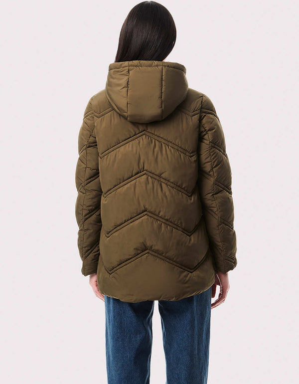 the back of a green puffer jacket perfect for hiking or trekking that was made from a environmentally conscious company