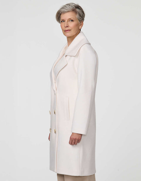 Calf-length double-breasted wool coat with oversized lapels, offering timeless sophistication and warmth.