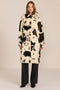 Women's faux calf hair car coat with oversized collar, button-front closure and cuff-tab details.