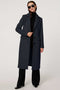 Women’s knee-length wool coat with tailored darts, patch pockets, and single-breasted three-button front.