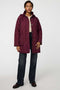Lightweight quilted puffer jacket for women. The perfect spring layer with drawstring hood and oversized pockets,