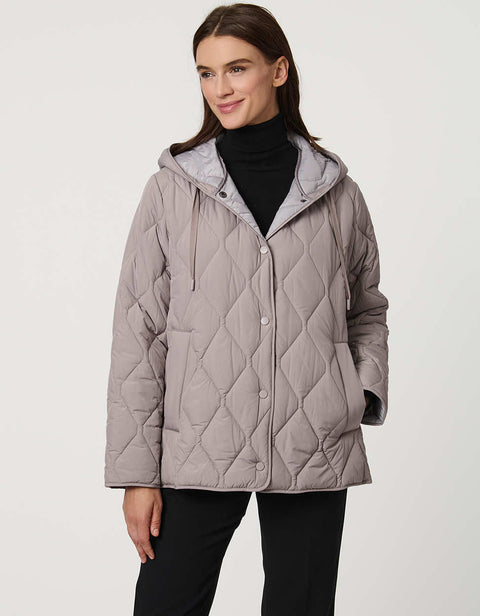 Oversized quilted puffer jacket with diamond stitching, drawstring hood, welt pockets, and snap front closures.