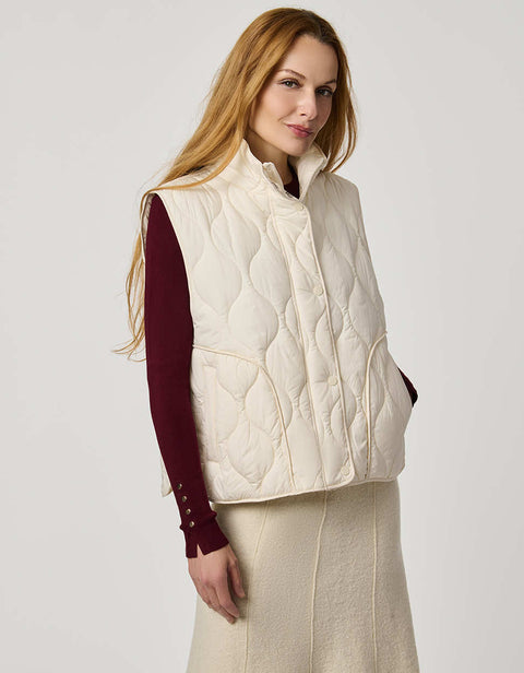 Women’s quilted puffer vest with oversized fit, funnel collar, zipper closure, and lightweight Ecoplume fill.