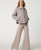 Classic quilted women’s puffer jacket with structured collar, snap closures, patch pockets, and Ecoplume fill.