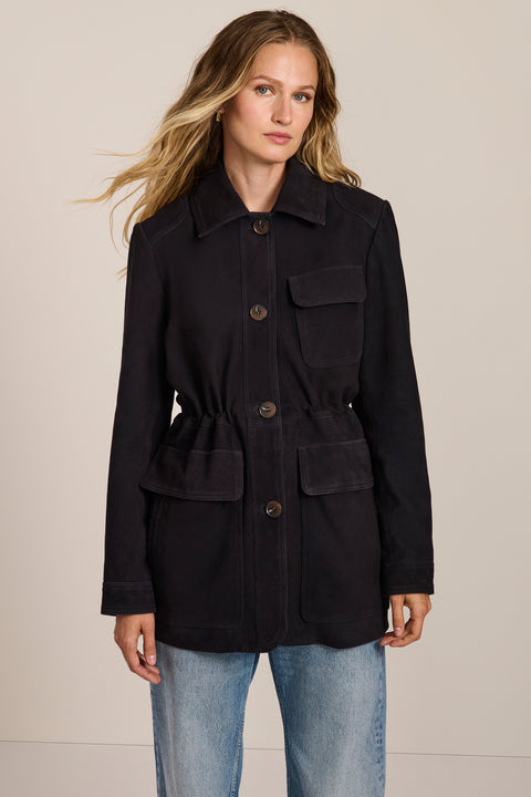 Women's genuine suede safari jacket with adjustable drawcord waist and four patch pockets.