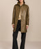Women's genuine leather car coat with point collar, button-front closure and side pockets.