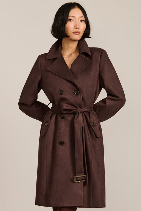 women's faux suede trench coat with a double-breasted front, notched lapels, belted waist and buckle cuff details.
