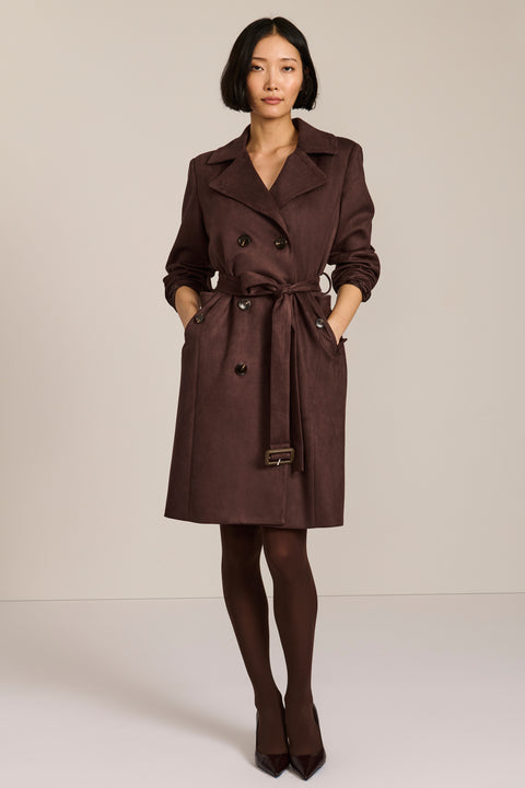 women's faux suede trench coat with a double-breasted front, notched lapels, belted waist and buckle cuff details.