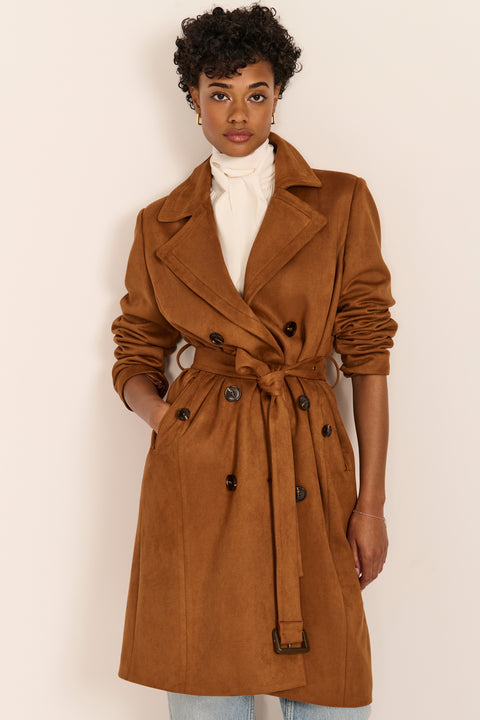 women's faux suede trench coat with a double-breasted front, notched lapels, belted waist and buckle cuff details.