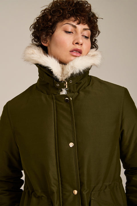 Insulated parka with removable faux fur collar, drawstring waist, oversized utility pockets and hidden zip closure.
