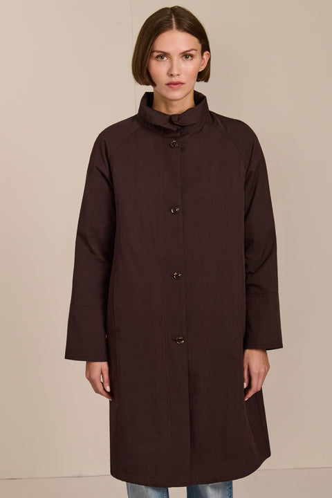 Women's two in one raincoat with removable quilted vest.