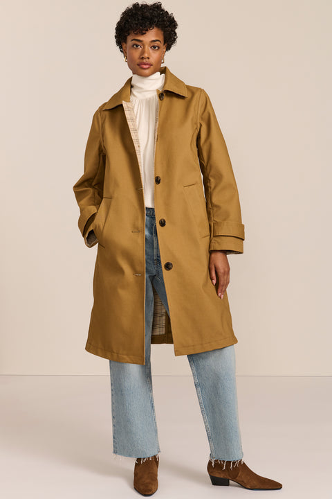 women's plaid-trim raincoat with a hood, stand collar, button-front closure, welt pockets and adjustable cuff tabs.