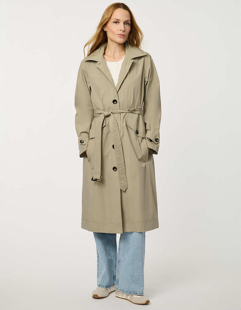 Women’s lightweight utility trench coat with belted waist, flap pockets, and roll-away hood tucked into the collar.