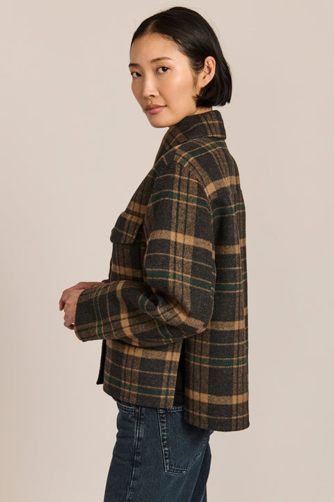 women's cropped plaid wool jacket featuring a point collar, button-front closure, and oversized flap pockets.