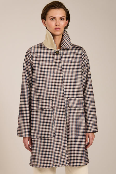 Women's check print raincoat with utility pockets, corduroy collar, and water-repellent finish