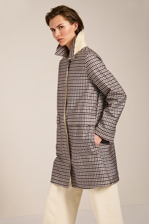 Women's check print raincoat with utility pockets, corduroy collar, and water-repellent finish