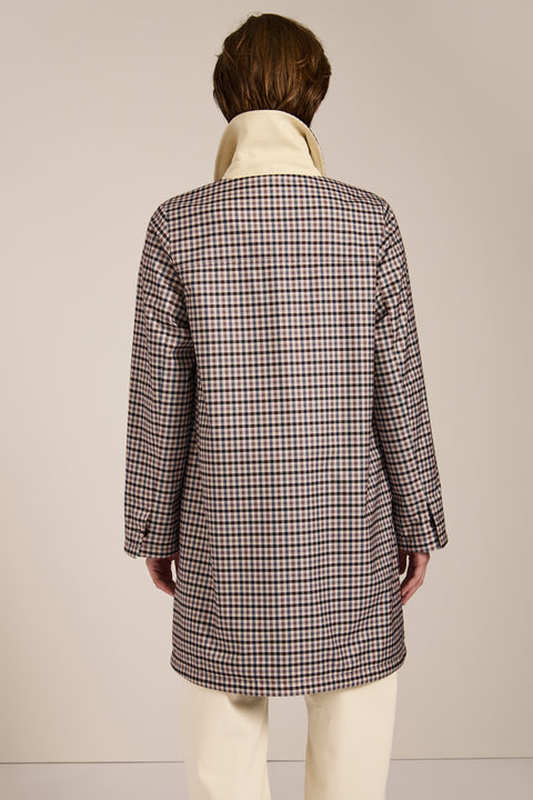 Women's check print raincoat with utility pockets, corduroy collar, and water-repellent finish