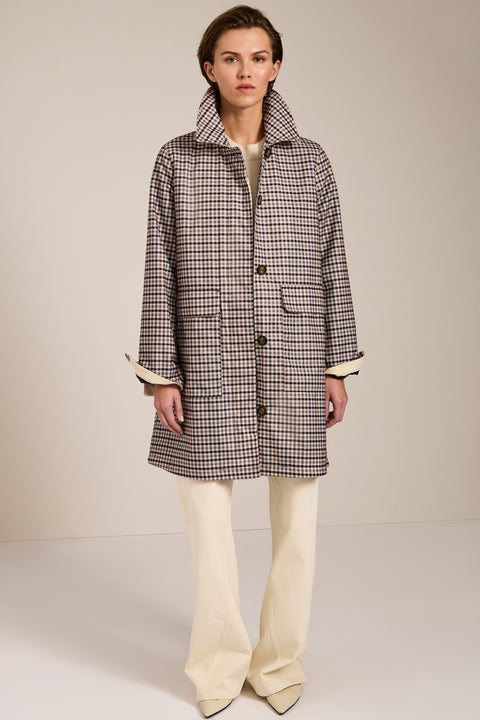 Women's check print raincoat with utility pockets, corduroy collar, and water-repellent finish