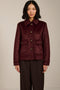 Women's faux calf hair jacket with utility pockets and button-front closure.