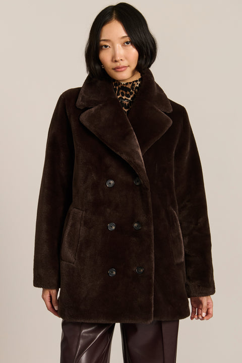 women's dark brown double-breasted faux fur coat with an oversized notched collar, button front, and angled pockets.