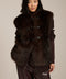 Women's faux fur vest with toggle closures, stand collar, and side pockets.