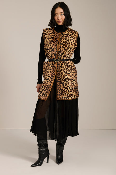 Long leopard print faux fur vest with collarless silhouette, faux leather trim and streamlined fit.