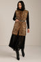 Long leopard print faux fur vest with collarless silhouette, faux leather trim and streamlined fit.