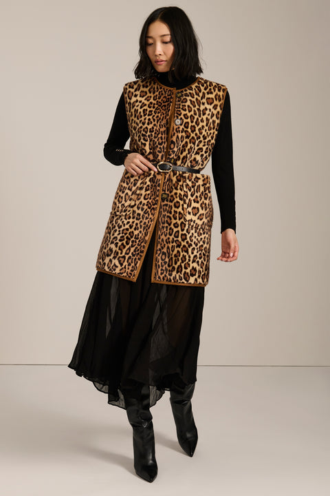 Long leopard print faux fur vest with collarless silhouette, faux leather trim and streamlined fit.