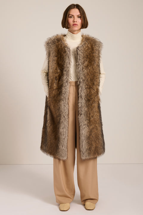 Brown-tipped faux fur long vest with collarless neckline, hook-and-eye closure and side seam pockets.