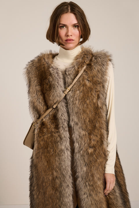 Brown-tipped faux fur long vest with collarless neckline, hook-and-eye closure and side seam pockets.