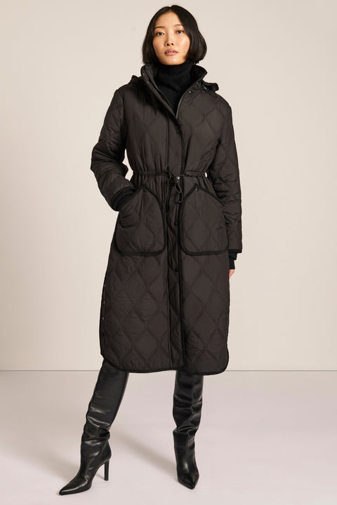 women's Long Quilted Puffer Coat with drawstring waist, hood, diamond quilting and longline silhouette.