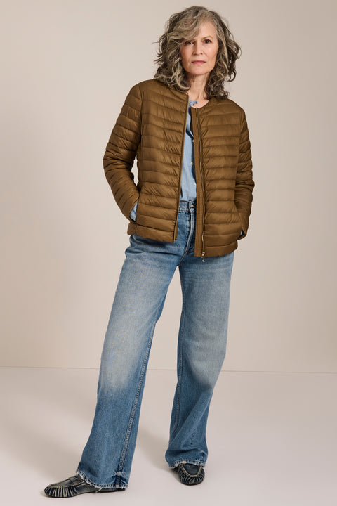 Lightweight packable quilted jacket with crew neckline, recycled insulation and zippered pockets.