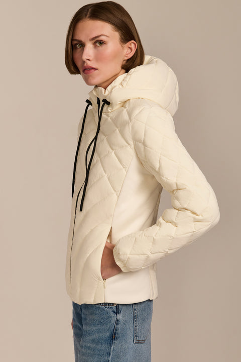 women's Quilted Puffer Jacket with geometric quilting, neoprene side panels, drawstring hood and contrast black zipper.