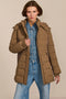 women's hooded puffer coat with horizontal quilting, flexible neoprene side panels, high collar and zip pockets.