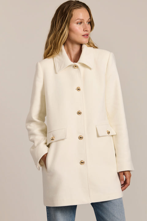 women's wool coat featuring a removable faux fur collar, gold-tone button-front closure and flap pockets.