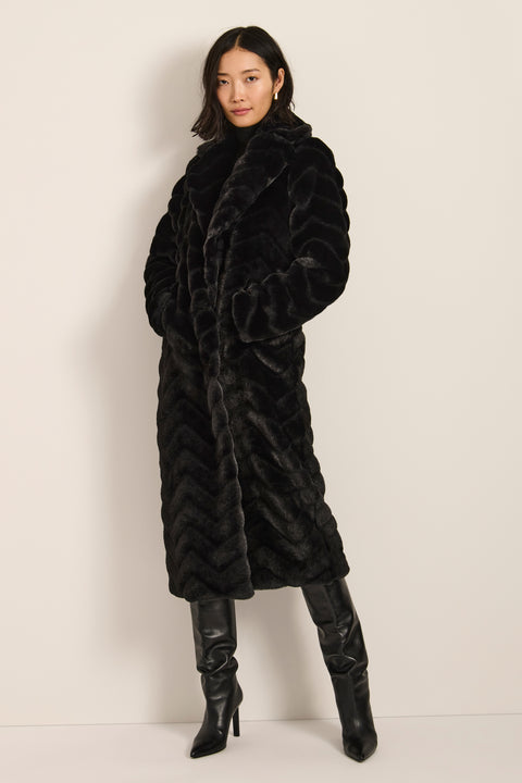 Long faux fur coat with chevron-textured finish, notch collar, button-front closure and full-length silhouette