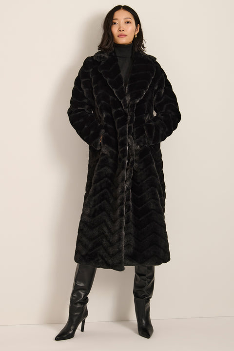 Long faux fur coat with chevron-textured finish, notch collar, button-front closure and full-length silhouette