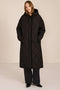 Oversized long puffer coat with diamond quilting, corduroy trim, hood, welt pockets, and Ecoplume insulation.