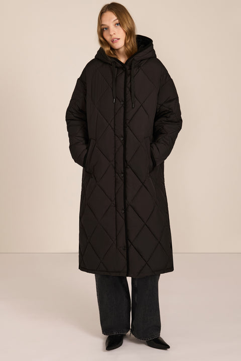 Oversized long puffer coat with diamond quilting, corduroy trim, hood, welt pockets, and Ecoplume insulation.