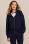 women's soft scuba full-zip jacket with blue contrast piping, high funnel collar and cinched waist.