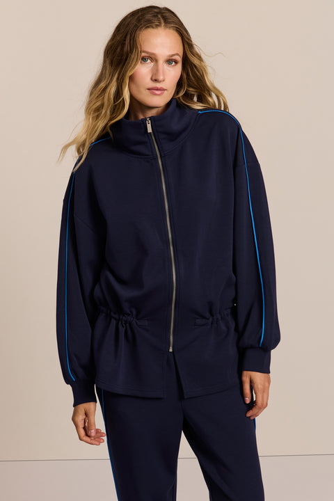 women's soft scuba full-zip jacket with blue contrast piping, high funnel collar and cinched waist.
