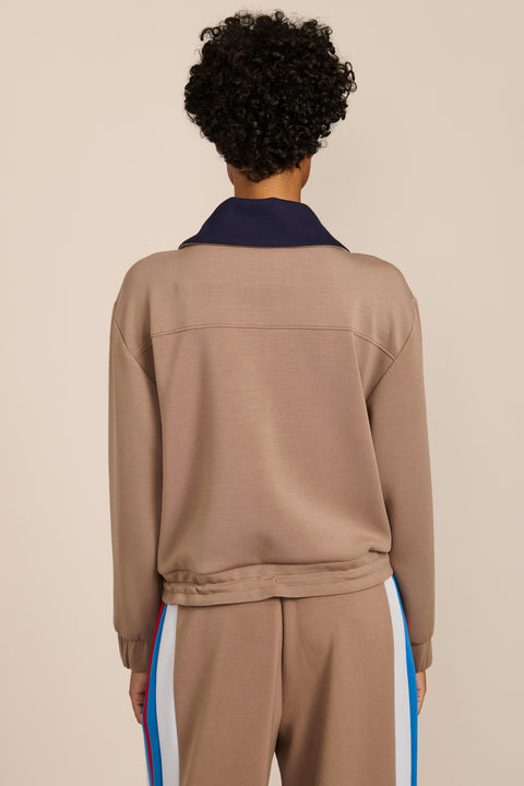 Women's soft scuba quarter-zip sweatshirt with navy contrast collar and relaxed fit.