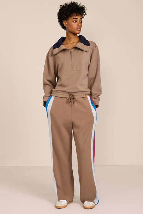 Women's soft scuba quarter-zip sweatshirt with navy contrast collar and relaxed fit.