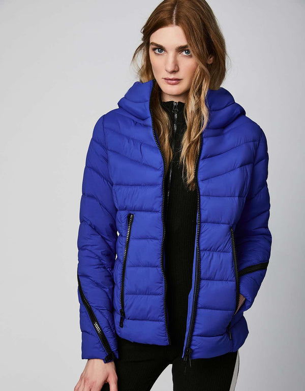 cobalt puffer jacket in cozy stretchable fabric that is cruelty free and exclusive of trim