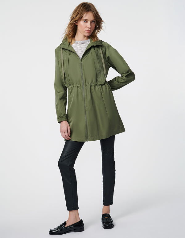 stylish mid length rain jacket with bungee waist in green perfect for urban explorers