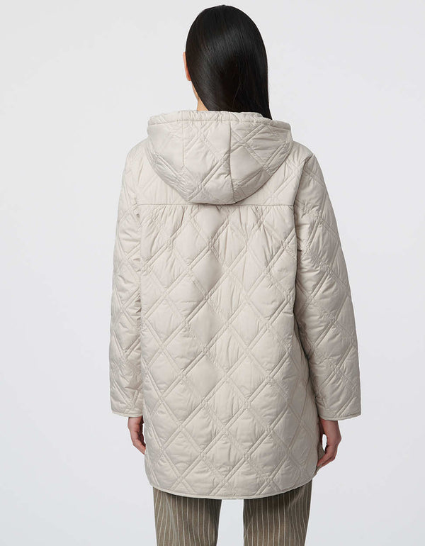 womens relaxed puffer jacket with sustainable filler that is lightweight and stylish for spring fashion