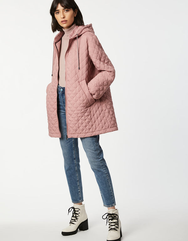 light pink quilted jacket made for lightweight layering with allover quilting in a sustainable filler